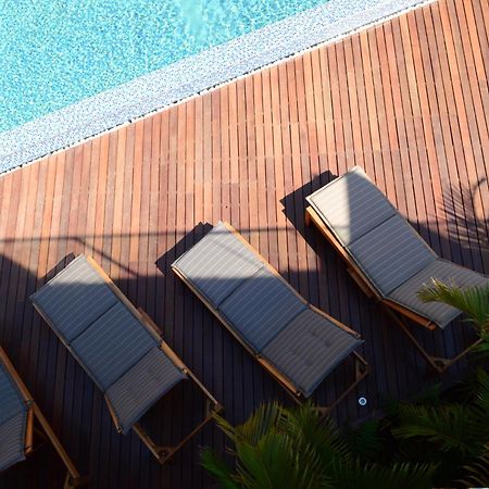 Menlyn Boutique Hotel Pretoria-Noord Extérieur photo Sunloungers by a pool