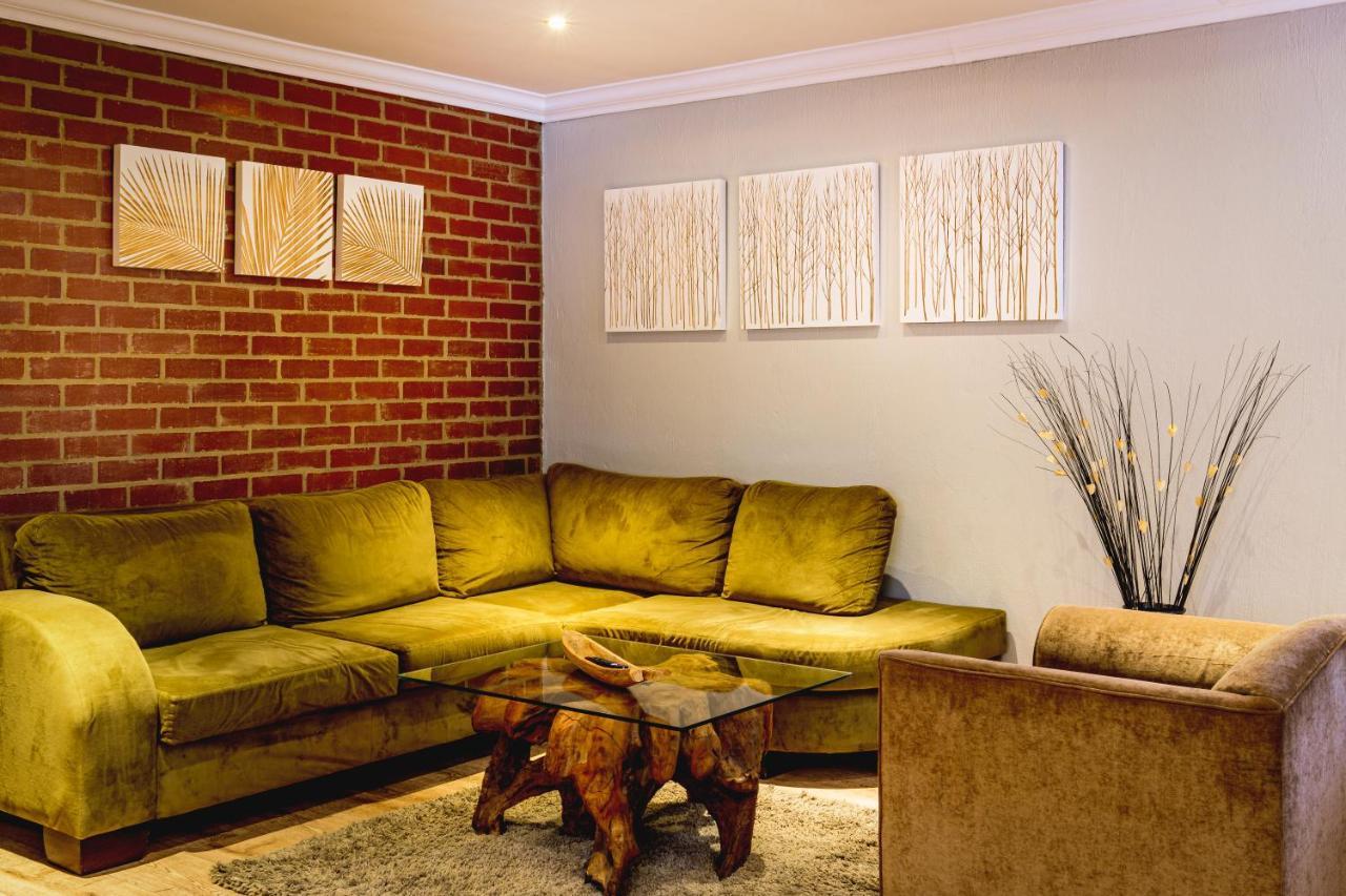Menlyn Boutique Hotel Pretoria-Noord Extérieur photo A living room